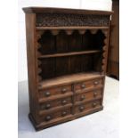 An Indian hardwood bookshelf/cabinet, heavily carved floral frieze,