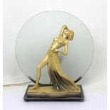 An Art Deco style figural lamp modelled as a naked female, with circular shade, height 37cm.