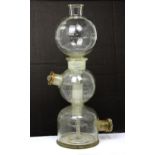 A large c1950s glass laboratory distilling apparatus, height 48cm.