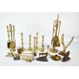 A collection of predominantly brass ware including candlesticks,