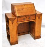 A 1940s kneehole desk with fitted interior, single drawer and three bookshelves to either side, 100.