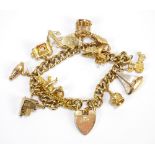 A 9ct yellow gold curb link charm bracelet with ten charms (eight hallmarked for 9ct yellow gold),