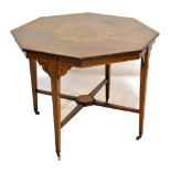 An Edwardian octagonal table with inlaid foliate detail on castors, diameter 90cm, height 72cm.