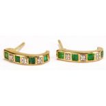 A pair of 9ct yellow gold emerald and diamond earrings of scrolling design, each drop approx 1.