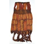 A rare Dida Ivory Coast raffia palm fibre and vegetable dye dress with natural twisted tassels,