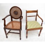 A cane seated open armchair with circular back and a bar back upholstered chair on ring turned