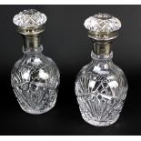 PREECE & WILLISCOMBE; a pair of George VI hallmarked silver collared clear cut glass decanters,