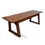An oak Arts and Crafts refectory table with plank top,