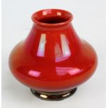 ROYAL LANCASTRIAN; a crimson glazed vase of squat baluster form, impressed marks to base,