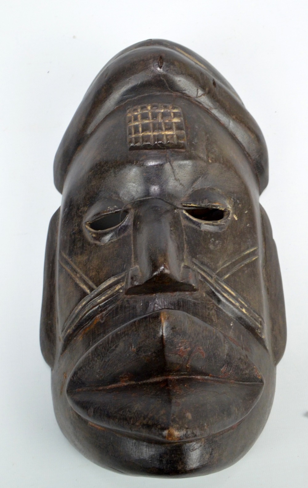 An African tribal mask, probably Nigerian, height 30.5cm.