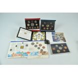 A collection of cased coins comprising a 1995 United Kingdom proof eight coin set,