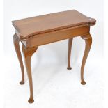 A 19th century mahogany card table with green baize top and counter wells on cabriole legs, approx.