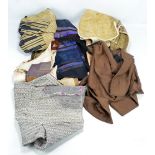 A quantity of Japanese textiles and garments including a waistcoat, rustic haori, various panels,