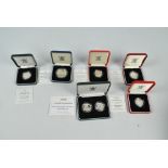 A collection of boxed United Kingdom silver proof coins comprising a 1995 two pound two coin set,
