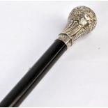 A white metal topped ebonised walking cane, length 96cm.