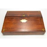 A rosewood and inlaid brass writing slope with fitted interior,