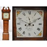 An early 19th century oak and mahogany crossbanded eight day longcase clock with broken swan neck