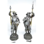 A pair of cast metal figures modelled as 17th century Spanish conquistadors,