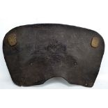 An unusual 18th century leather section of saddle embossed with a flower and inscribed 'IL, 1776',