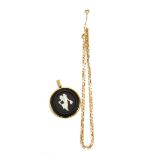 A Wedgwood black basalt jasperware pendant in yellow metal mount suspended on a 44cm 9ct yellow