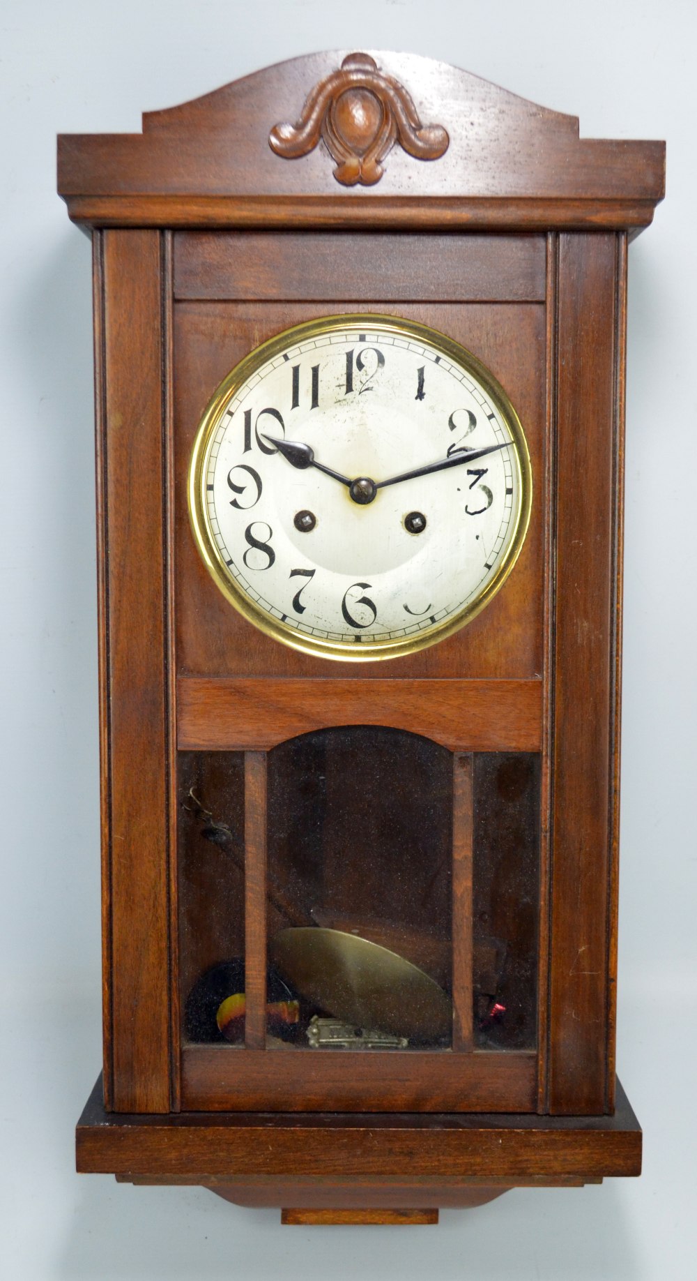 A wall clock, the circular silver dial set with Arabic numerals, dial diameter 16cm,