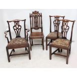 A Victorian oak hall chair with carved oak leaf detail and fluted turned stretcher supports,