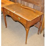 A mid-18th century walnut two drawer writing table, width 103cm (leg af).