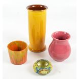 BRANHAM, BARUM WARE; a yellow/orange glazed cylindrical tall vase, height 19cm, a pink glazed vase,