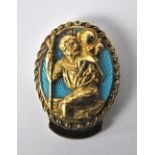 An oval 9ct yellow gold and enamel St. Christopher clip, 3.8 x 3cm, approx 24.6g, with box.