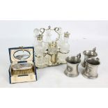 An electroplated framed and clear glass six piece cruet set by J.