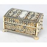 A tortoiseshell and pen work decorated bone and ivory trinket box with hinged lid on four paw feet,