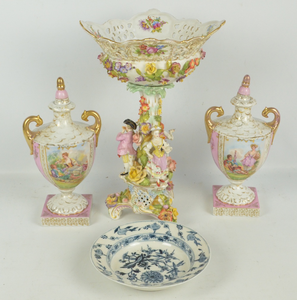 A late 19th/early 20th century German porcelain ornamental comport with stem modelled as three