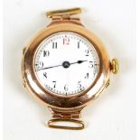A 9ct yellow gold lady's wristwatch, the white circular enamel dial set with Arabic numerals,