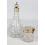 MAPPIN & WEBB; an Elizabeth II hallmarked silver collared clear cut glass decanter, Birmingham 1961,