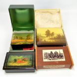 Three Russian lacquered trinket boxes with painted lids to include a river landscape,