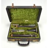 A cased Boosey & Hawkes of London ebonised series 2-20 clarinet, number 205630.