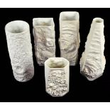 KAISER; a group of five matt white glazed vases, naturalistically modelled with fossilized shells,