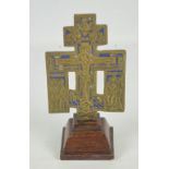 A late 19th century Russian Orthodox brass and enamel detailed cross,