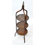 An Edwardian mahogany and inlaid three-tier cake stand, height approx 97cm.