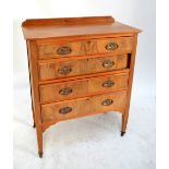 An Edwardian walnut chest and dressing table with triple mirror back (2).