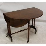 A Victorian walnut oval Sutherland table, two ring turned end columns and outswept legs to castors,