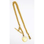 A 9ct yellow gold graduated curb link pocket watch chain with T-bar suspending a George V half