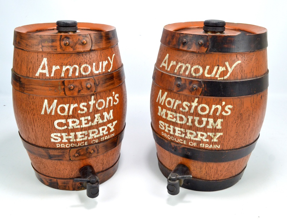 A pair of 'Armoury Marston's' cream sherry barrels, height 34cm.