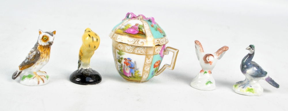 An early 20th century Meissen porcelain figure of female peacock, an owl (both af) and a bird,