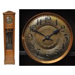 An early 20th century oak cased two weight chiming longcase clock,