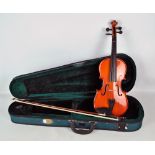 A cased Stentor Student ST 3/4 size violin and bow.