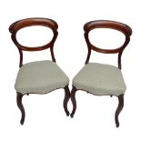 A set of four Victorian mahogany balloon back chairs with cabriole front legs (4).