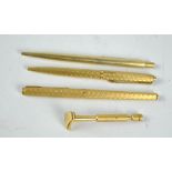 Three gold plated/toned Parker pens comprising one fountain and two ballpoints,