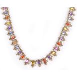 An 18ct white gold fancy necklace comprising approx 22cts of mixed sapphires and gemstones and