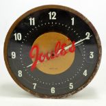 A Joule's advertising/bar clock, the circular face set with painted Arabic numerals,
